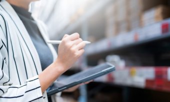 A professional woman checking inventory